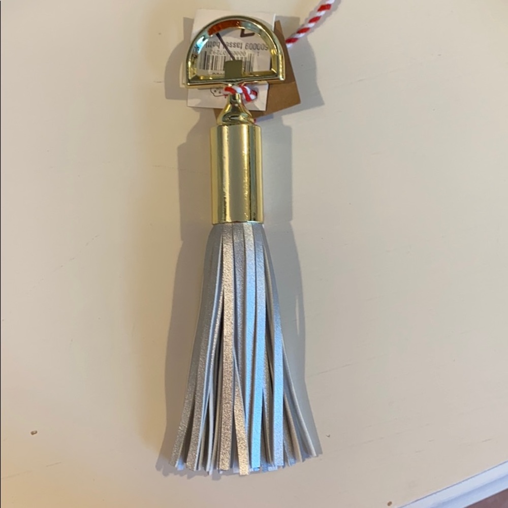 Silver fringe decorative bottle opener!